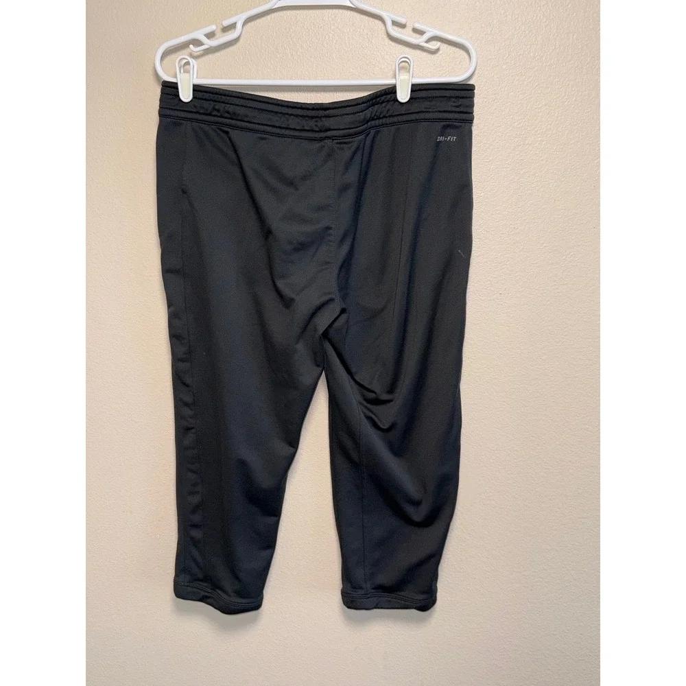 Nike Dri-FIT Women Black Cropped Athletic Joggers Zipper Pockets Orange Swoosh L
